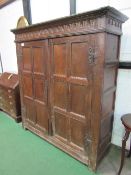 Large oak 17th century hanging cupboard, double doors, gouge carving to top, hanging pegs to