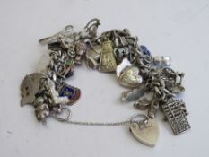 Sterling silver charm bracelet, weight 2.3ozt. Estimate £120-150.