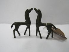 2 small bronze modernist figures of horses in the style of Frederick Weinberg. Estimate £25-40.