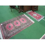 Pink ground Pakistan rug, 130 x 80 & a red ground Middle Eastern prayer mat, 90 x 57. Estimate £30-