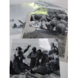 4 black & white D-Day photographs & photograph of The Mascot on a WWII American Bomber. Estimate £