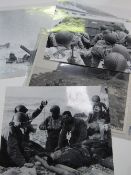 4 black & white D-Day photographs & photograph of The Mascot on a WWII American Bomber. Estimate £