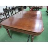 Edwardian extendable mahogany dining table on tapered fluted legs to brass castors, 180cms (