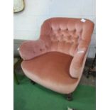Pink upholstered Victorian low armchair. Estimate £30-50.