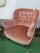 Pink upholstered Victorian low armchair. Estimate £30-50.