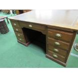Large Partners' oak desk with leather skiver, drawers to one side & cupboards to the other end