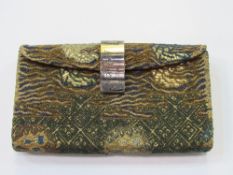 Japanese Meiji period silk embroidered purse c/w metal looking glass. Estimate £800-1,000.