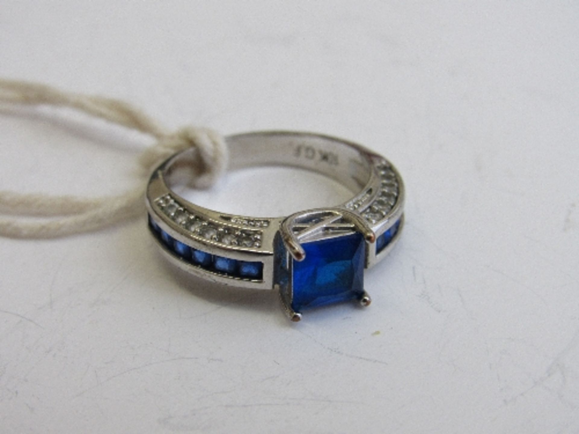 10ct white gold with blue stone ring, size P, weight 4.7gms. Estimate £50-60.