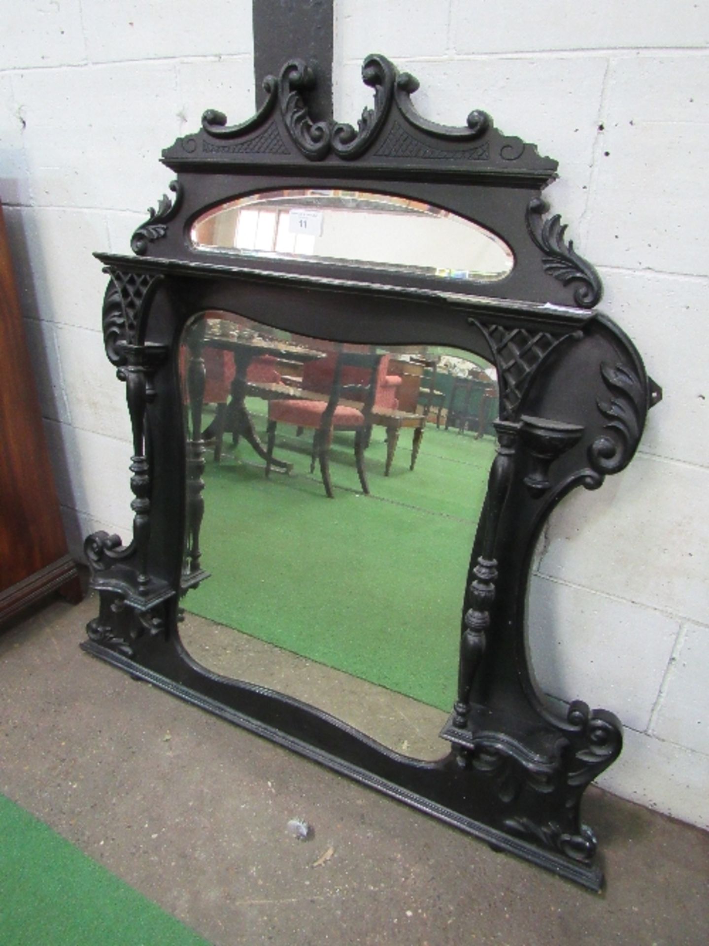 Ebonised ornate over mantle mirror with shaped sides, 130cms x 124cms. Estimate £30-50. - Image 2 of 2