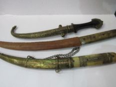 2 bone handled daggers & an antique Turkish-style brass mounted dagger in brass scabbard.