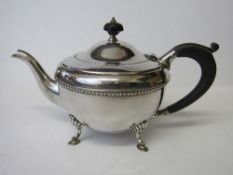 Hallmarked silver bowl-shaped footed teapot with wooden mounts, Birmingham 1930, weight 16ozt.