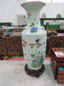 Large oriental vase on wooden stand, height 66cms. Estimate £100-150.