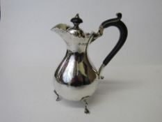 Hallmarked silver footed lidded jug, London 1906 with wooden mounts, weight 8.0ozt. Estimate £50-