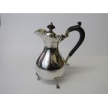 Hallmarked silver footed lidded jug, London 1906 with wooden mounts, weight 8.0ozt. Estimate £50-