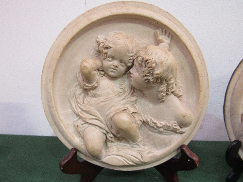 1 Putti circular plaque signed E W Wyon & 1 other not signed. Estimate £30-50.