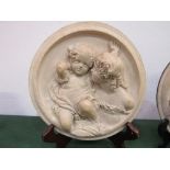 1 Putti circular plaque signed E W Wyon & 1 other not signed. Estimate £30-50.