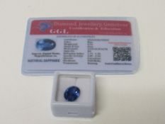 Natural blue oval cut loose sapphire, wt 9.1 carat, with certificate. Estimate £50-70.