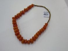 String of Butterscotch, amber, Bakelite celluloid prayer necklace. Estimate £30-50.