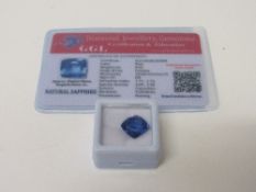 Natural blue cushion cut loose sapphire, wt 8.5 carat, with certificate. Estimate £50-70.