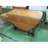 Oak gate-leg table on barley twist legs, 135cms (open) x 92cms. Estimate £20-40.