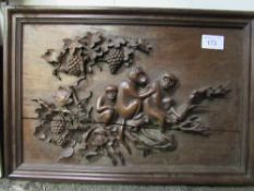 Carved hardwood panel of monkeys. Estimate £10-20.