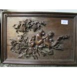 Carved hardwood panel of monkeys. Estimate £10-20.