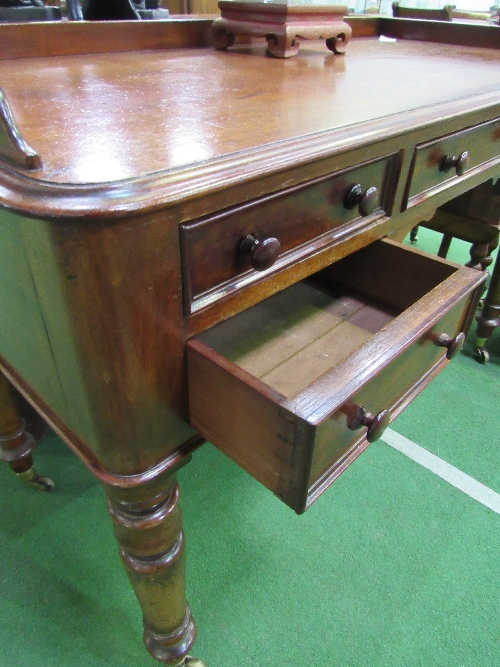 Mahogany writing desk on turned legs to casters, 122cms x 57cms x 77cms. Estimate £80-100. - Image 2 of 4