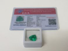 Natural trillion cut loose emerald, 6.70 carat, with certificate. Estimate £50-70.