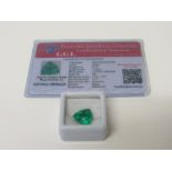 Natural trillion cut loose emerald, 6.70 carat, with certificate. Estimate £50-70.