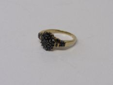 Lady's 9ct gold sapphire cluster ring set with 1/2 carat of sapphires. Estimate £70-80.