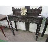 Ebonised hall table, carved frieze drawer on bobbin-turned front legs, 90cms x 31cms x 91cms.