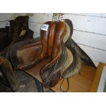 3 leather saddles