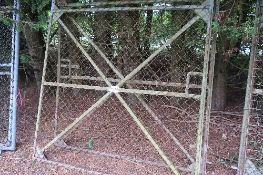 Pair of mesh covered angle iron framed yard gates