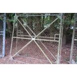 Pair of mesh covered angle iron framed yard gates