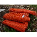 4 rolls of red plastic barrier netting
