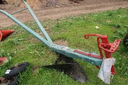 A 'surrey' wooden frame single furrow horse drawn plough with cast iron shear by Lintott Horsham