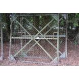 Pair of mesh covered angle iron framed yard gates