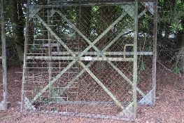 Pair of mesh covered angle iron framed yard gates