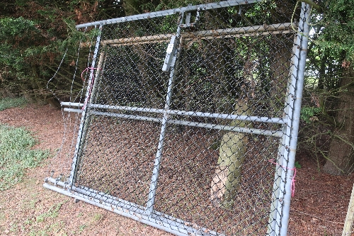Pair of tubular steel galvanised mesh covered yard gates