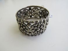 Indian silver decorative bangle. Estimate £40-60.