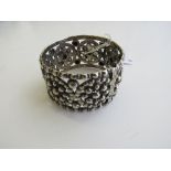 Indian silver decorative bangle. Estimate £40-60.