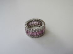 Silver, pink & white stone fashion eternity ring with 1 stone missing, size N. Estimate £20-30.