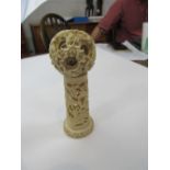 Chinese carved ivory puzzle ball on carved ivory stand. Estimate £80-150.