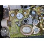 A large qty (37) of brass miniature quartz clocks. Estimate £20-30.