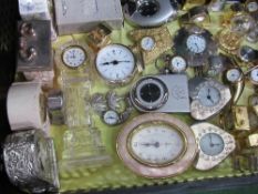 A large qty (37) of brass miniature quartz clocks. Estimate £20-30.