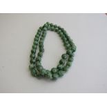 Natural jade bead necklace (hand knotted). Estimate £250-350.