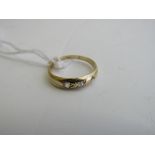 18ct gold (tested) 3 stone diamond ring, size J, weight 1.6gms. Estimate £40-60.