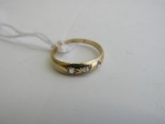 18ct gold (tested) 3 stone diamond ring, size J, weight 1.6gms. Estimate £40-60.