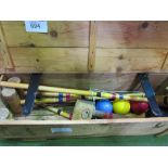 Junior croquet set in wooden box. Estimate £20-40.