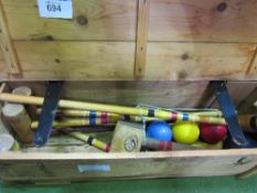 Junior croquet set in wooden box. Estimate £20-40.